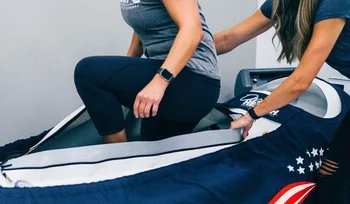 Patient receiving hyperbaric oxygen therapy in a pressurized chamber for recovery and wellness.