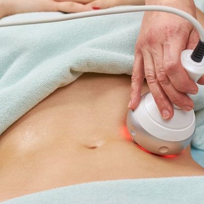 Healthcare professional performing an EVOLT 360 body composition assessment using advanced body analysis technology.