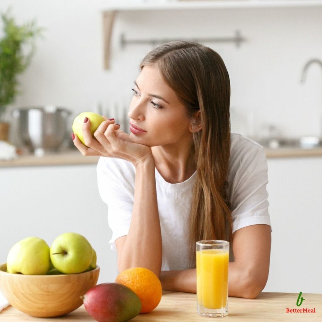 Woman making healthy nutrition choices as part of a personalized health coaching program.