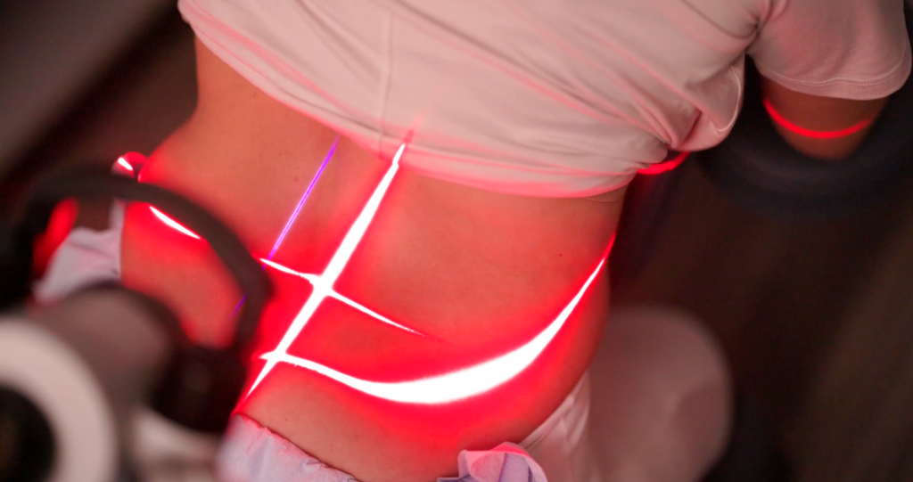FX 405 cold laser therapy being applied to the neck for non-invasive pain relief and healing