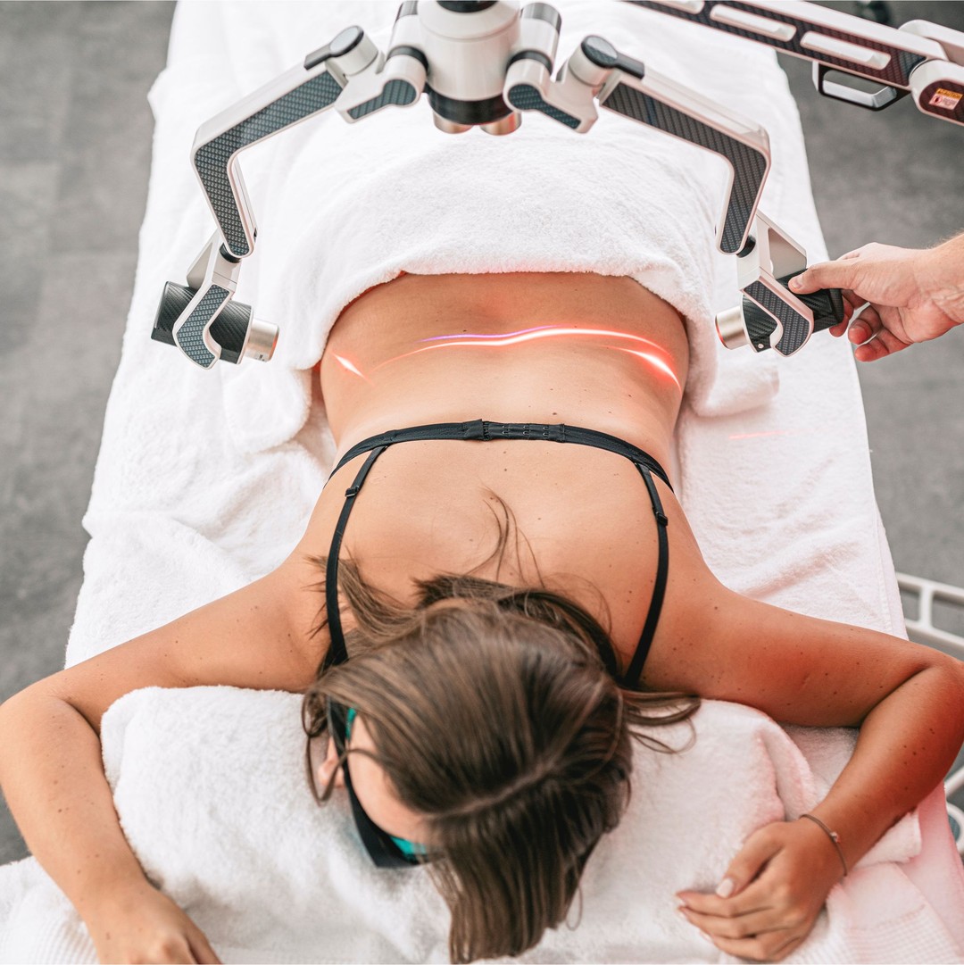 Patient relaxing in an infrared sauna to support detoxification and recovery.