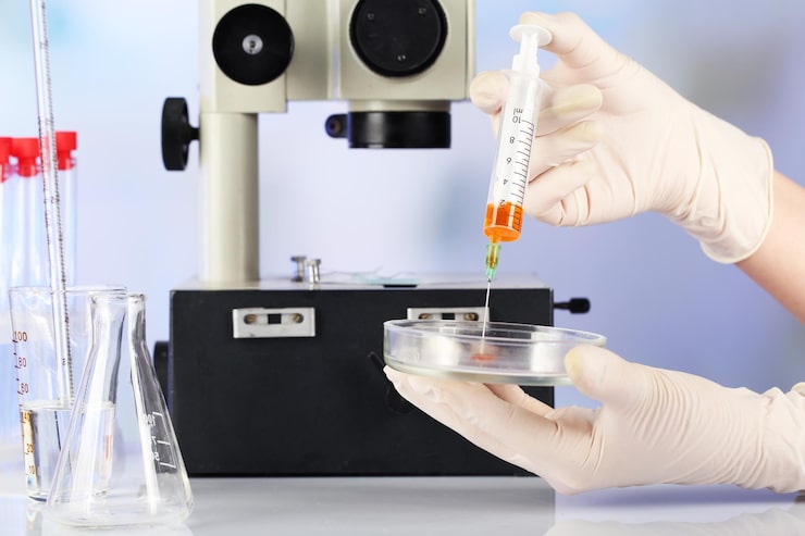 Laboratory professional performing heavy metals testing using advanced diagnostic equipment.
