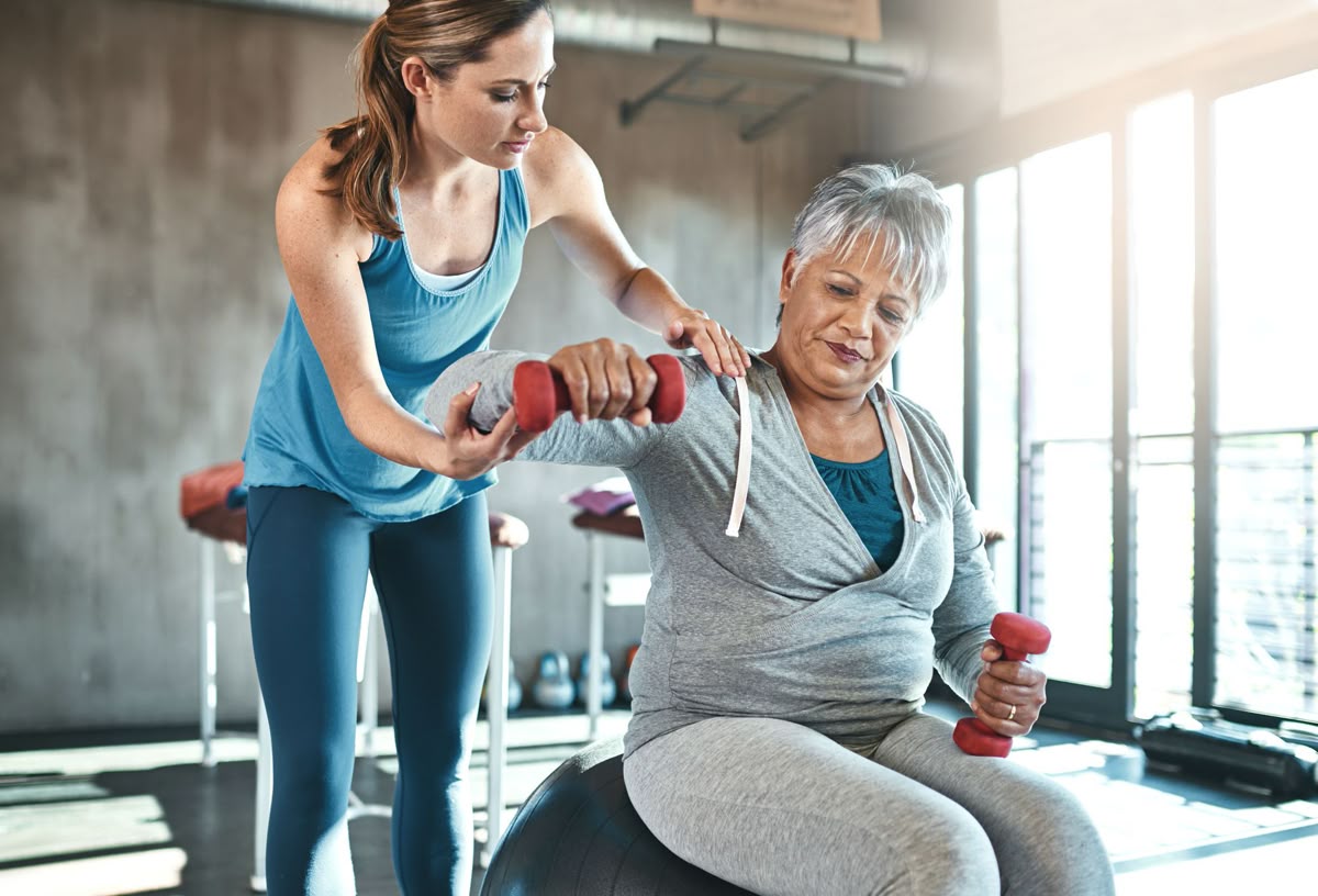 Healthcare provider monitoring patient progress and adjusting a personalized wellness plan.
