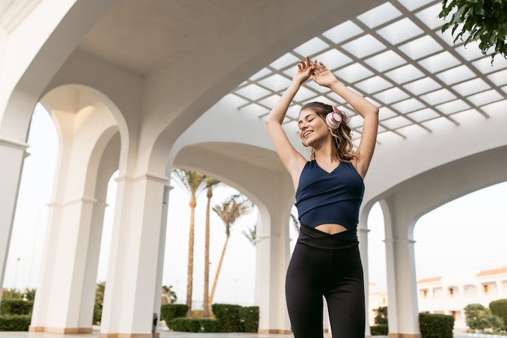 Woman exercising outdoors as part of a personalized longevity and performance medicine program.