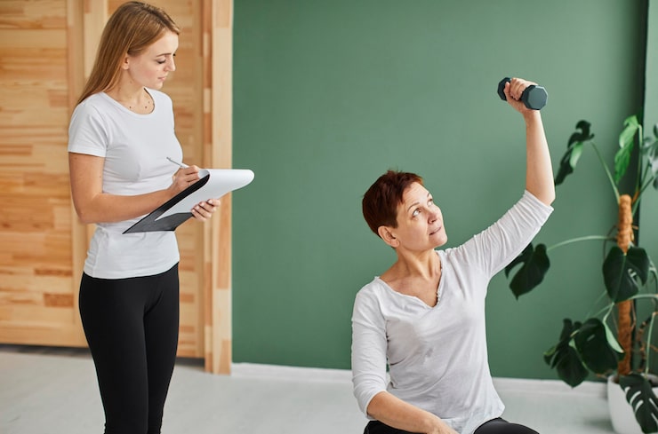 Health coach guiding a client through personalized fitness and wellness activities.