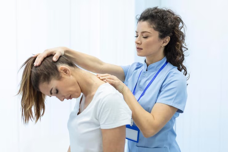 Chiropractor performing a gentle neck adjustment to improve spinal alignment and overall wellness.
