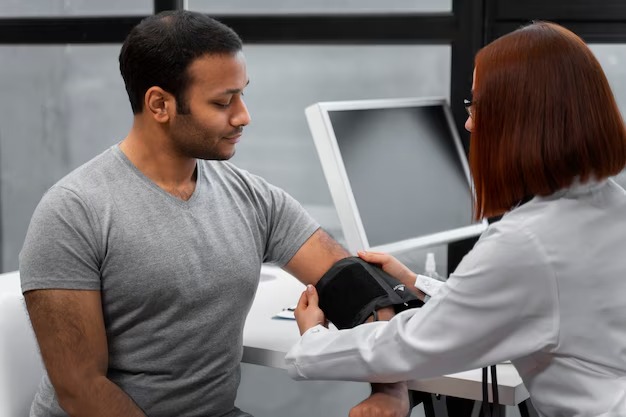 Healthcare provider checking a patient's blood pressure during a comprehensive health evaluation