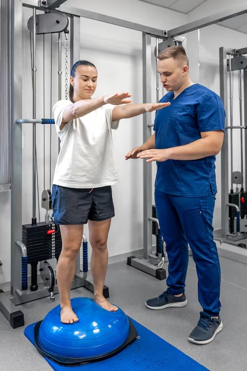 Physical therapist evaluating a patient's balance, strength, and mobility during a personalized assessment.
