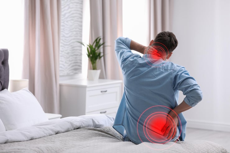 Person experiencing lower back pain, representing chronic pain management and improved mobility.