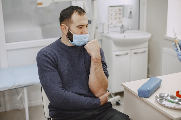 Patient attending a medical consultation for autoimmune disease evaluation and treatment planning.