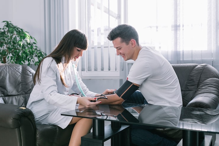 Healthcare provider reviewing health progress and personalized wellness strategies with a patient.