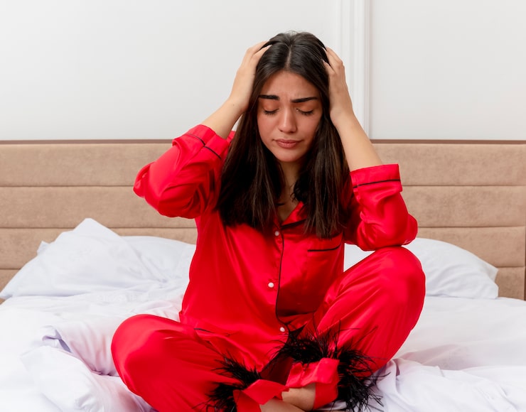Woman experiencing symptoms of hormonal imbalance before a hormone health consultation.