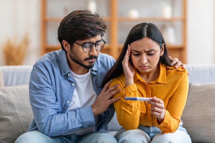 Couple receiving support while addressing fertility challenges and reproductive health concerns.